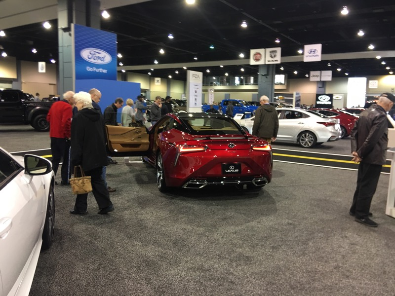 Lexus LC500, surrounded by old people